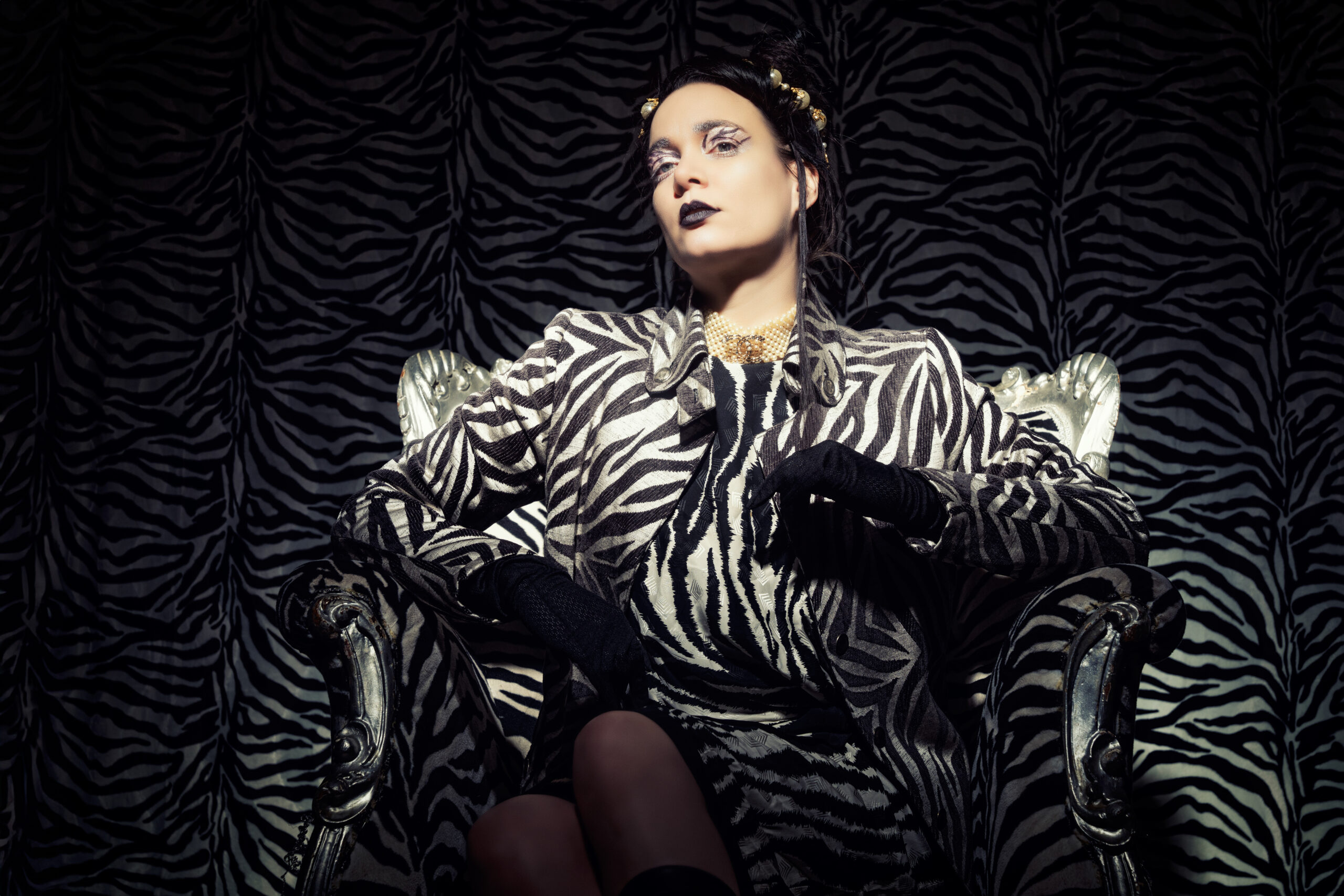 model in a zebra print suit for Improve your lighting a photography workshop by Frank Doorhof